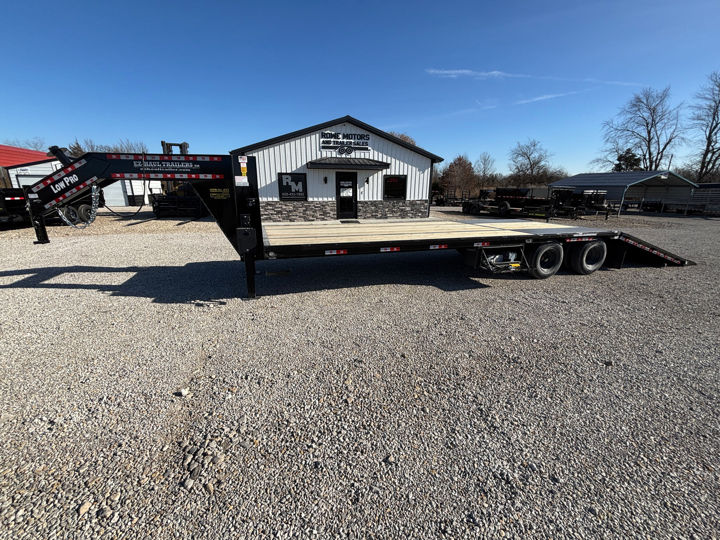 2025 EZ-Haul 32' Hydraulic Dovetail Flatbed Trailer W/ Hydraulic Jacks